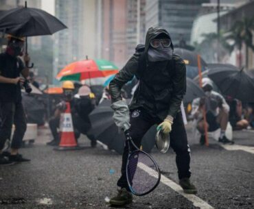 Protesters whip back tear gas with rackets (not mine)