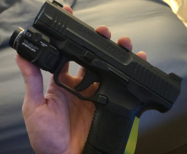 3d printed a custom back strap for my handgun. looks kinda cyberpunk to me.