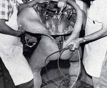 Disney technicians repairing an animatronic figure