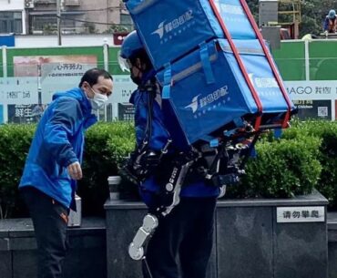 Delivery person in Wuhan using exo-skeleton to help him carry more parcels.