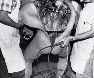 Disney technicians repairing an animatronic figure