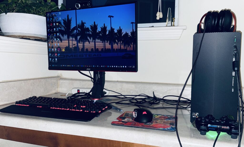 DisneyWorld 2012 mousepad? Check. DualShock 3? Check. Shitty chair? Check. Poor wire management? Check.