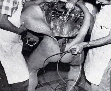Disney technicians repairing an animatronic figure