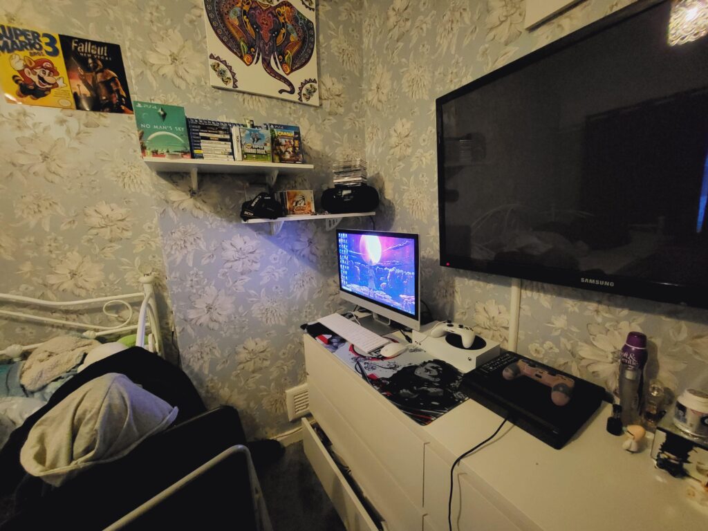 Here's my gaming set up. Would love a gaming chair, but would need a bigger bedroom