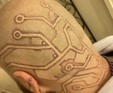 Got a cyberpunk head tat.