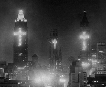 Buildings with lighted crosses to honor Good Friday in April 1956