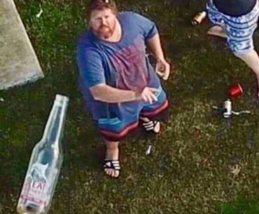 People throwing bottles at police drones that patrol over their property