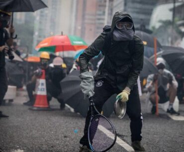 Protesters whip back tear gas with rackets (not mine)
