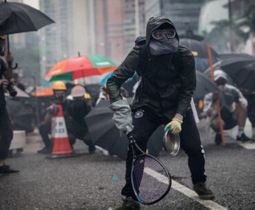 Protesters whip back tear gas with rackets (not mine)
