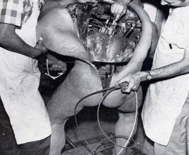 Disney technicians repairing an animatronic figure
