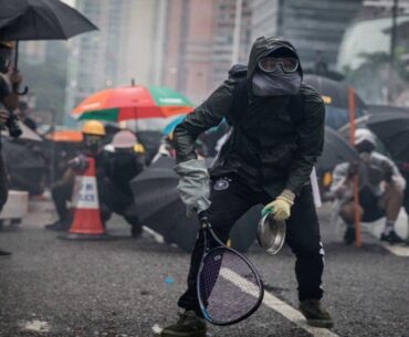 Protesters whip back tear gas with rackets (not mine)