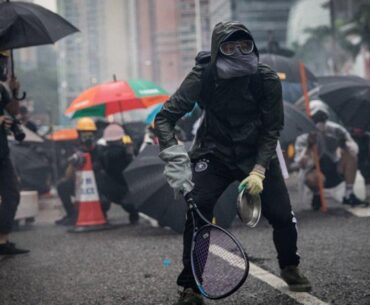 Protesters whip back tear gas with rackets (not mine)