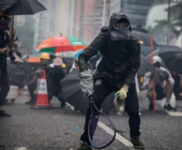 Protesters whip back tear gas with rackets (not mine)