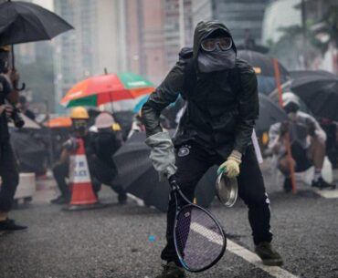 Protesters whip back tear gas with rackets (not mine)