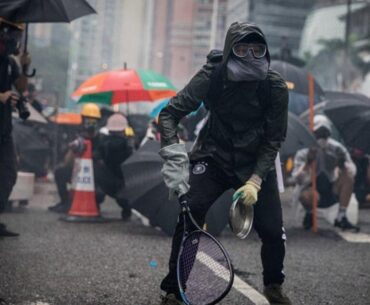 Protesters whip back tear gas with rackets (not mine)
