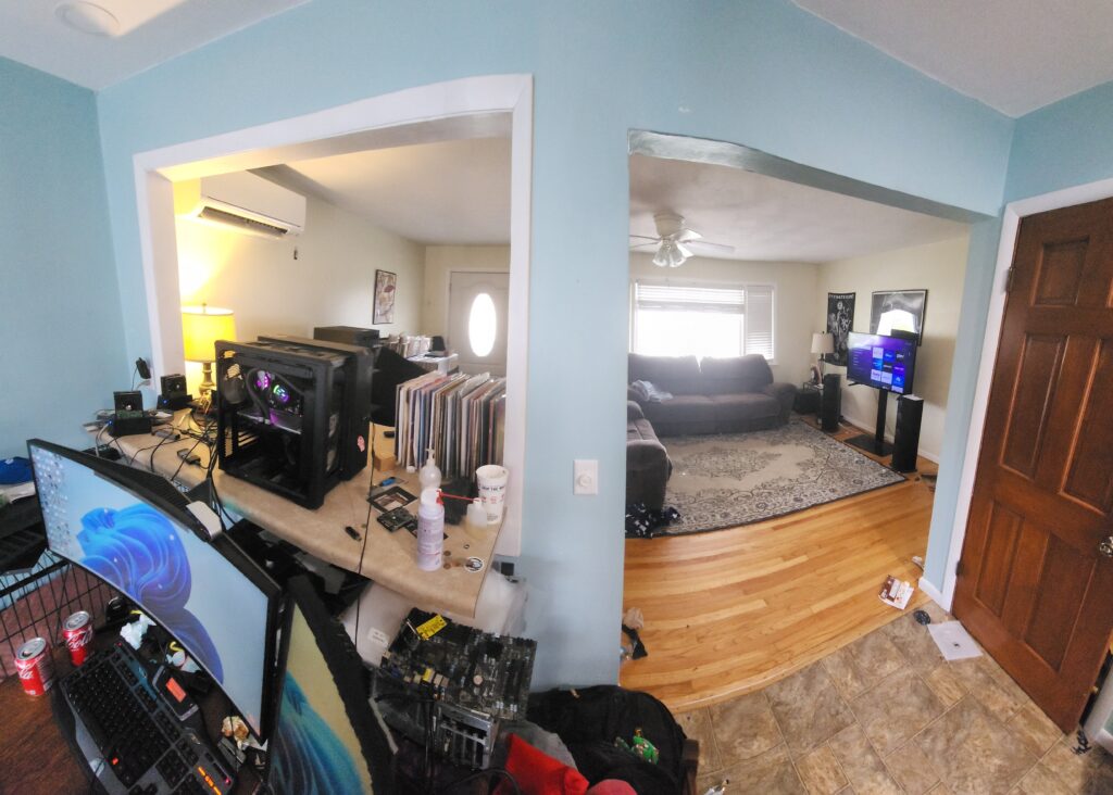 Living room and the dining room battle station. Being a bachelor, dining room table never got used.Â Now its my desk, the desktop sits on the breakfast bar with my turntable and some LP's. Desktop is 5800x/Kraken z63 and 6900xt reference/EKWB Radeon edition AIO