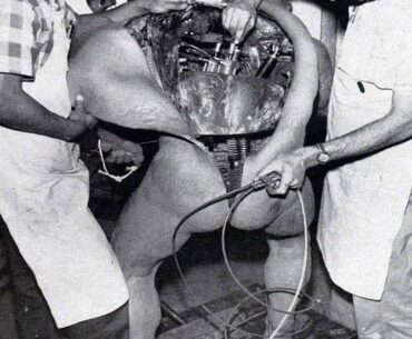 Disney technicians repairing an animatronic figure