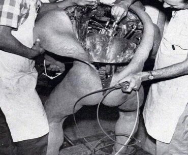 Disney technicians repairing an animatronic figure