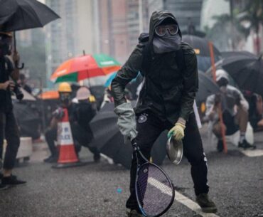 Protesters whip back tear gas with rackets (not mine)