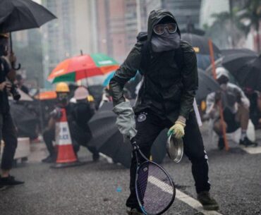 Protesters whip back tear gas with rackets (not mine)