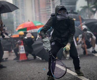 Protesters whip back tear gas with rackets (not mine)