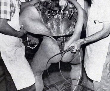 Disney technicians repairing an animatronic figure
