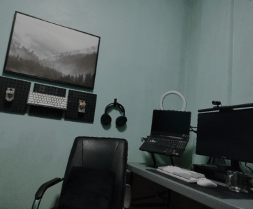 Trying to improve my WFH/Gaming space. Any advice? What should I add in the wall behind my laptop and monitor? Changing my desk soon.