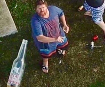 People throwing bottles at police drones that patrol over their property