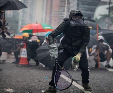 Protesters whip back tear gas with rackets (not mine)