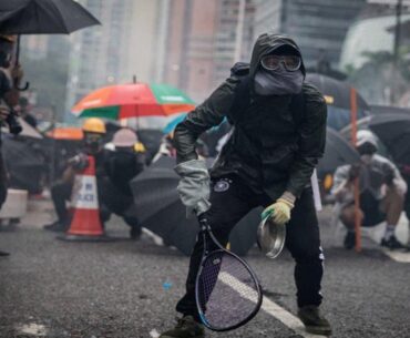 Protesters whip back tear gas with rackets (not mine)