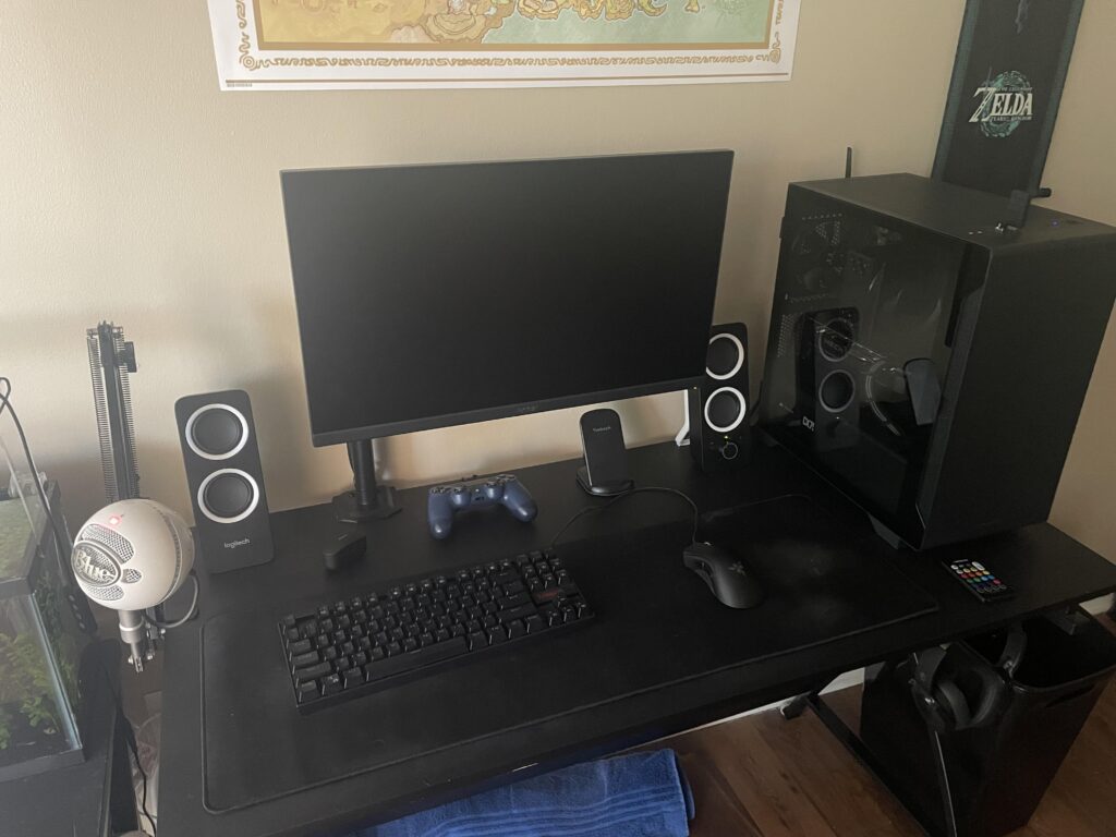 Just bought a monitor arm to clear up some of my limited desk space. Besides a wireless mouse and cleaner wall decor, what other improvements should I make to the desk area?