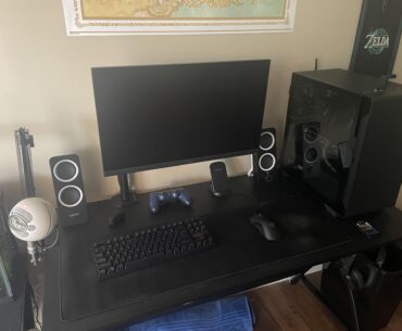 Just bought a monitor arm to clear up some of my limited desk space. Besides a wireless mouse and cleaner wall decor, what other improvements should I make to the desk area?