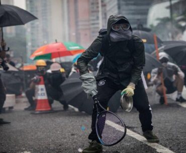 Protesters whip back tear gas with rackets (not mine)