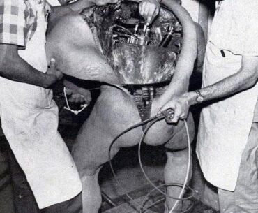 Disney technicians repairing an animatronic figure