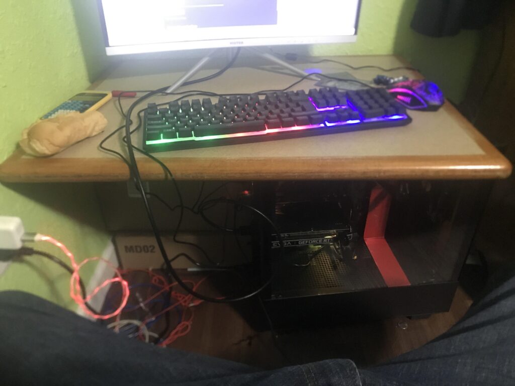 A friends setup ft. a restaurant table top being help up by empty boxes and tower