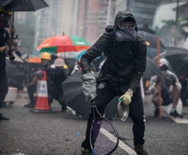 Protesters whip back tear gas with rackets (not mine)