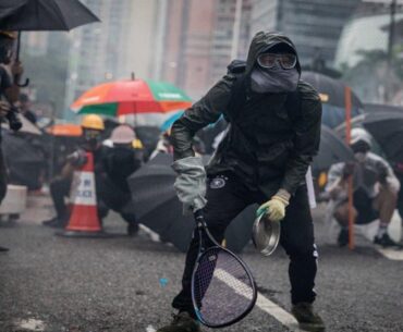 Protesters whip back tear gas with rackets (not mine)