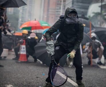 Protesters whip back tear gas with rackets (not mine)