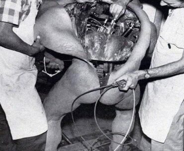 Disney technicians repairing an animatronic figure
