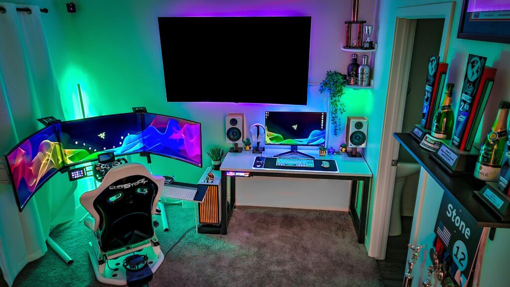 Finally got my multi-use setup done. 4090 runs the triples, separate 4k desktop monitor and a VR setup for the racing simulator