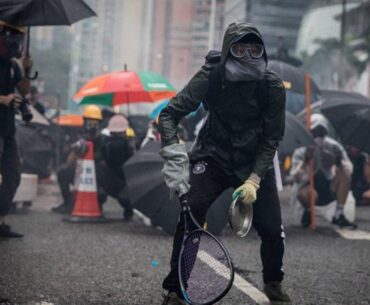 Protesters whip back tear gas with rackets (not mine)