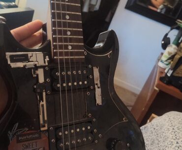 Just a guitar I glued random phone parts to