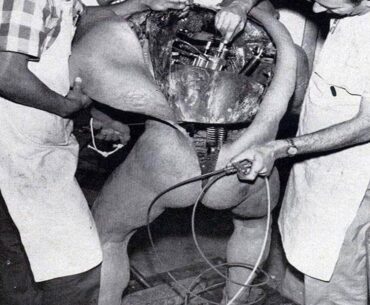 Disney technicians repairing an animatronic figure