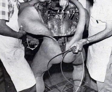 Disney technicians repairing an animatronic figure