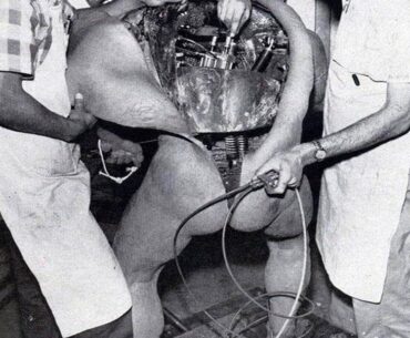 Disney technicians repairing an animatronic figure