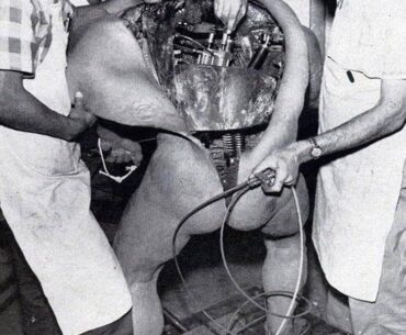 Disney technicians repairing an animatronic figure