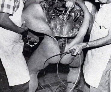Disney technicians repairing an animatronic figure