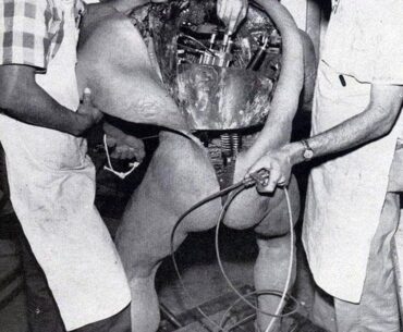 Disney technicians repairing an animatronic figure