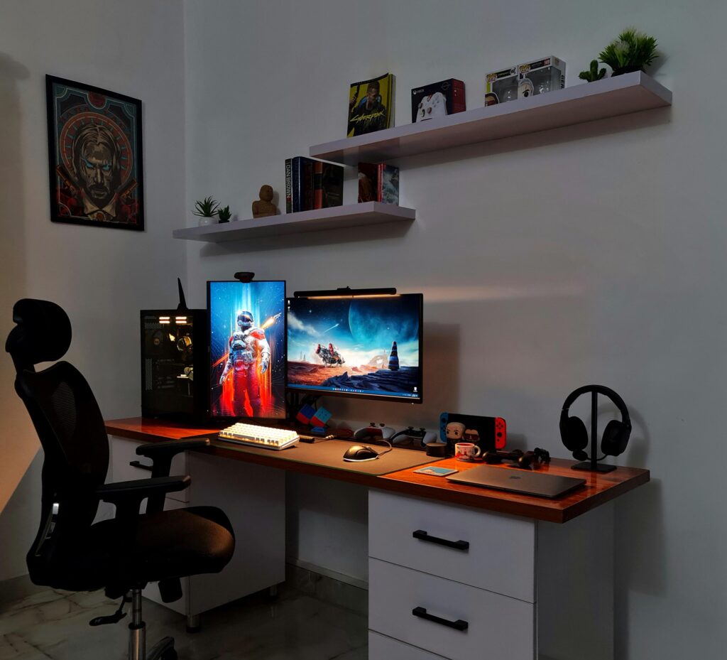 Where I Game and Work (Area above and below the shelves is a bit empty, working on those)