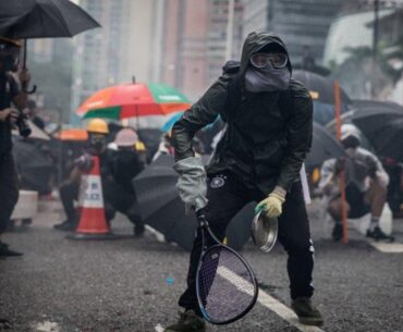 Protesters whip back tear gas with rackets (not mine)